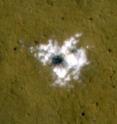 The HiRISE camera on NASA's Mars Reconnaissance Orbiter took this image of a new, 8-meter (26-foot)-diameter meteorite impact crater in the topographically flat, dark plains within Vastitas Borealis, Mars, on November 1, 2008. The crater was made sometime after Jan. 26, 2008. Bright water ice was excavated by, and now surrounds, the crater. This entire image is 50 meters (164 feet) across.