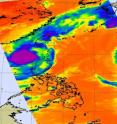 Aqua's Atmospheric Infrared Sounder (AIRS) instrument captured Parma's (left area of purple and blue) high thunderstorm cloud temperatures that were colder than minus 63 Fahrenheit.  On the right edge of the satellite's view is the western half of Super Typhoon Melor (resembling a half moon).