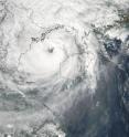 NASA's MODIS instrument captured this view of Tropical Storm Parma approaching Vietnam on Oct. 13 at 0555 UTC (1:55 a.m. EDT). Hainan Island is to the right of the storm's eye and Vietnam is to the left. The very center of Parma's eye is cloud-free. NASA's MODIS instrument captured this view of Tropical Storm Parma approaching Vietnam on Oct. 13 at 0555 UTC (1:55 a.m. EDT). Hainan Island is to the right of the storm's eye and Vietnam is to the left. The very center of Parma's eye is cloud-free.