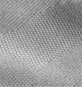 This electron micrograph shows a self-assembled composite in which nanoparticles of lead sulfide have arranged themselves in a hexagonal grid.