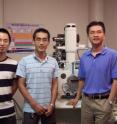 Dr. Yong Zhu and his research team stand front of a scanning electron microscope. From left to right, they are Feng Xu, Qingquan Qin and Yong Zhu. Dr. Yong Zhu and his research team stand front of a scanning electron microscope. From left to right, they are Feng Xu, Qingquan Qin and Yong Zhu.