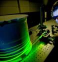 A researcher is testing an optical fiber system in the Institute for Photonics & Advanced Sensing, University of Adelaide.