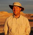 Paleontologist Sterling Nesbitt at Hayden Quarry on Ghost Ranch in northern New Mexico. Nesbitt, a post doctoral researcher at the University of Texas at Austin, and his colleagues discovered <I>Tawa hallae</I>, a previously unknown theropod dinosaur. Paleontologist Sterling Nesbitt at Hayden Quarry on Ghost Ranch in northern New Mexico. Nesbitt, a post doctoral researcher at the University of Texas at Austin, and his colleagues discovered <I>Tawa hallae</I>, a previously unknown theropod dinosaur.