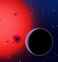 This artist's conception shows the newly discovered super-Earth GJ 1214b, which orbits a red dwarf star 40 light-years from our Earth. It was discovered by the MEarth project -- a small fleet of ground-based telescopes no larger than those many amateur astronomers have in their backyards.