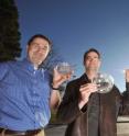 From left to right, Sandia researchers Murat Okandan, Greg Nielson, and Jose Luis Cruz-Campa, hold samples containing arrays of microsolar cells.