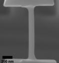 Scanning electron microscope image of a typical as-fabricated 100-nm-diameter tensile sample. Scanning electron microscope image of a typical as-fabricated 100-nm-diameter tensile sample.