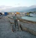 Civil engineering professor Marc Eberhard stands at Haiti's main port in Port-au-Prince. The soil beneath liquefied, which causes paved surfaces like this one to collapse.