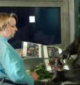 Kanzi, shown with Great Ape Trust researcher Liz Rubert-Pugh, routinely points to lexigram symbols to express his thoughts. He also points in response to conversation, as a human would, a topic addressed in a paper on pointing behavior by Great Ape Trust scientists.