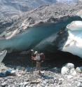 Northern Arizona University geographer Erik Schiefer surveys a debris-covered glacier margin.