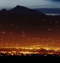 The reddish glow from the city lights of Boulder, Colo., is the result in part of the light being scattered by haze particles. UW scientists have discovered unexpected chemistry involving the pollutants that make up the haze.
