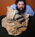 Mark Loewen, paleontologist with the Utah Museum of Natural History at the University of Utah, displays the new dinosaur species, <i>Seitaad ruessi</i>, which is derived from the Navajo word, “Seit’aad,” a sand-desert monster from the Navajo (Diné) creation legend that swallowed its victims in sand dunes.  The skeleton of Seitaad had been 'swallowed' in a fossilized sand dune when it was discovered.