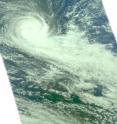 NASA's Aqua satellite captured a visible image of Cyclone Imani on March 25 at 0747 UTC (3:47 a.m. EDT, showing Imani developed a "tail" of clouds stretching southeast of its center. The white area is outside of the satellite's "vision."