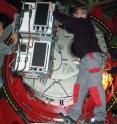 Technicians install the LUCIFER instruments on the Large Binocular Telescope in the fall of 2008.