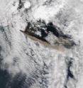 A visible satellite image on Wednesday, May 12 at 13:10 UTC (9:10 a.m. EDT) from NASA's Aqua satellite's moderate resolution imaging spectroradiometer instrument captured the Eyjafjallajokull Volcano's ash plume (brown). Compared to the MODIS image from May 11, this image shows that lower level winds have shifted from blowing to a southerly direction to a more east-southeasterly direction, as an occluded front is positioned just to the east of the volcano. An occluded front is a frontal boundary where cold, warm and cool air come in conflict. This system is a cold occlusion, where cold air near the surface is moving under less cold air aloft. It has created winds that are blowing from the west-northwest (as the front passes), taking the brown volcanic ash plume in an east-southeasterly direction in this image.