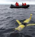 A Rutgers/Webb SLOCUM glider is deployed from a Zodiac near Palmer Station Antarctica.  Automated glider robots can measure ocean characteristics continuously for weeks at a time.