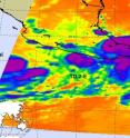 NASA's Aqua satellite captured an infrared image of TD2-E hugging the coast of western Mexico (small rounded area, center) and the western half of Tropical Storm Blas that appears as a half circle (left). Both have high, strong thunderstorms in their center (purple).