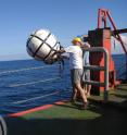To study the rock layers below the seabed, researcher Jamie Austin of University of Texas at Austin and vessel crew deploy a sound source (airguns) and a listening cable ‘streamer’ to record the sound waves as they are reflected back towards the surface.