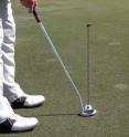 Expert putters focus only on the hole and the back of the ball.