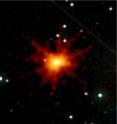 The brightest gamma-ray burst ever seen in X-rays temporarily blinded Swift's X-ray Telescope on 21 June 2010. This image merges the X-rays (red to yellow) with the same view from Swift's Ultraviolet/Optical Telescope, which showed nothing extraordinary.  (The image is 5 arcminutes across.)