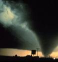 A tornado bears down on a small community.