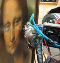 This photo was taken during the measurements on the Mona Lisa: X-ray  fluorescence spectrometry was done directly on the paintings in the  Louvre Museum.