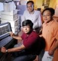Associate professor Niren Murthy, postdoctoral fellows Seungjun Lee (l-r standing) and Kousik Kundu (seated), all of the Wallace H. Coulter Department of Biomedical Engineering at Georgia Tech and Emory University, display confocal fluorescence images showing that the deuterium version of DHE was more effective than its hydrogen counterpart at detecting small amounts of reactive oxygen species.