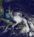 GOES-13 captured a visible image on July 22 at 1515 UTC (11:15 a.m. EDT) of Tropical Depression 3 (right) as it was bringing rains over the Bahamas and Hispaniola.