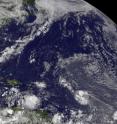 The GOES-13 satellite visible image from 1145 UTC on August 3, shows Tropical Storm Colin (bottom center) as a compact area of clouds in the central Atlantic Ocean. The GOES-13 satellite visible image from 1145 UTC on August 3, shows Tropical Storm Colin (bottom center) as a compact area of clouds in the central Atlantic Ocean.