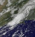 This visible image from the GOES-13 satellite on August 18 at 14:31 UTC (10:31 a.m. EDT) shows the remnants of TD5 stretches from Louisiana northeast into Mississippi. The high-resolution image shows some higher thunderstorms embedded in the cloud cover.