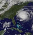 The GOES-13 satellite captured a visible image of Tropical Storm Fiona approaching Bermuda at 1825 UTC (2:25 p.m. EDT). The Category 4 Hurricane Earl nearing North Carolina's coast is located on the left (in the larger image), the much smaller Fiona is located on the lower right.