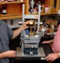 Iowa State University's Ronald Holtan, left, and Walter Trahanovsky are using high-pressure vessels like this to create high-value chemicals from biomass.