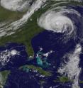 This image from the GOES-13 satellite at 10:32 a.m. EDT on Sept. 3 shows a huge Hurricane Earl northeast of North Carolina with cloud cover stretching over the northeastern US. A disorganized Fiona is located in the bottom right side of this image.
