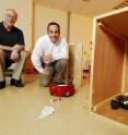 Georgia Tech Regents professor Ronald Arkin (left) and research engineer Alan Wagner look on as the black robot deceives the red robot into thinking it is hiding down the left corridor. Georgia Tech Regents professor Ronald Arkin (left) and research engineer Alan Wagner look on as the black robot deceives the red robot into thinking it is hiding down the left corridor.
