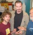 Alan Wood, Ryan Hechinger and Armand Kuris are pictured here with California horn snails that host tiny parasitic worms.