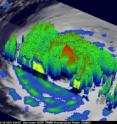 This 3-D image of Igor's cloud heights and rainfall from NASA and JAXA's Tropical Rainfall Measuring Mission satellite data shows a large area of heavy rainfall (falling at about 2 inches per hour) shown here in red on Sept. 15 at 0353 UTC. The yellow and green areas indicate moderate rainfall between .78 to 1.57 inches per hour. The image reveals that Igor's eye was still very distinct but the southwestern portion of the eye wall had eroded.