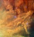 This close-up shot of the center of the Lagoon Nebula (Messier 8) clearly shows the delicate structures formed when the powerful radiation of young stars interacts with the hydrogen cloud they formed from.

This image was created from exposures taken with the Wide Field Channel of the Advanced Camera for Surveys on Hubble. Light from glowing hydrogen (through the F658N filter) is colored red. Light from ionized nitrogen (through the F660N filter) is colored green and light through a yellow filter (F550M) is colored blue. The exposure times through each filter are 1560 s, 1600 s and 400 s respectively. The blue-white flare at the upper-left of the image is scattered light from a bright star just outside the field of view. The field of view is about 3.3 by 1.7 arcminutes.