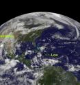 In this image from 1445 UTC (10:45 a.m. EDT) on Sept. 22, GOES-13 captured Tropical Storm Lisa in the far eastern Atlantic (right), a developing tropical low near in the south-central Caribbean Sea (center), and Tropical Storm Georgette (far left) in the eastern Pacific Ocean, making landfall in Baja California.