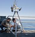 Study author Timothy Crone (left) prepares to deploy a camera designed to monitor the flow of hydrothermal vents off the US Pacific northwest. He used similar technology to estimate the flow of the gulf oil spill.