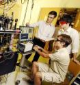 Researchers Alex Radnaev and Jacob Blumoff (standing) and Yaroslav Dudin collect data for a study of quantum information systems at the Georgia Institute of Technology.