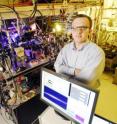 Associate professor Alex Kuzmich poses with equipment used to study quantum information systems at the Georgia Institute of Technology.