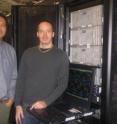 University of Ottawa researchers Tom Woo (left) and Peter Boyd (right) with the computer cluster used to simulate and analyze the CO2 capture.