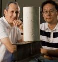Pedro Alvarez (left) and Jaesang Lee are pictured with a concrete cylinder and a steel I-beam, which are among the construction materials that manufacturers could improve with nanomaterials.