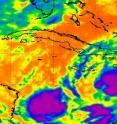 NASA's Aqua satellite AIRS instrument captured an infrared image of Tropical Storm Tomas' clouds (right) on Nov. 4 at 2:59 a.m. EDT. Tomas showed strong convective activity in his center as indicated by high thunderstorms (in purple) that were as cold as -63F. A second area of showers and thunderstorms located to the southwest of Tomas is associated with a trough of low pressure.