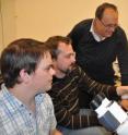 Warren MacDonald (left), Bart Bryant (center) and Alexander Raikhel examine results from their experiments on female <i>Aedes aegypti</i> mosquitoes.