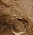 Schiaparelli is a large impact basin about 460 km across, located in the eastern Terra Meridiani region of the planet’s equator. The image shows just a small part of the basin's northwestern rim cutting diagonally across the image (top left–bottom right) and a smaller 42-km-diameter crater embedded in its rim. The image is centred on the equator of Mars, at a longitude of about 14°E. The image was taken on July 15, 2010, by the High-Resolution Stereo Camera (HRSC) on ESA's Mars Express. The spacecraft was completing orbit 8,363 of Mars and the ground resolution of the image is about 19 m per pixel. Schiaparelli is a large impact basin about 460 km across, located in the eastern Terra Meridiani region of the planet’s equator. The image shows just a small part of the basin's northwestern rim cutting diagonally across the image (top left–bottom right) and a smaller 42-km-diameter crater embedded in its rim. The image is centred on the equator of Mars, at a longitude of about 14°E. The image was taken on July 15, 2010, by the High-Resolution Stereo Camera (HRSC) on ESA's Mars Express. The spacecraft was completing orbit 8,363 of Mars and the ground resolution of the image is about 19 m per pixel.