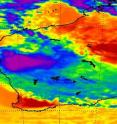 NASA's Atmospheric Infrared Sounder (AIRS) infrared instrument onboard the Aqua satellite showed System 91S on Dec. 17 at 0547 UTC (12:47 a.m. EST) inland over in Western Australia and dumping heavy rainfall. Powerful thunderstorms with heavy rainfall appear in purple.