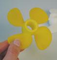 This propeller was dyed yellow in only five minutes at 90 degrees C and 200 bar. At this pressure, the yellow dye powder dissolved in the CO<sub>2</sub> which transferred it into the plastic.