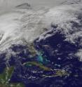 This visible image was captured by the GOES-13 satellite and shows the low pressure area stretching from the Colorado Rockies and Texas east to New England. The image shows the storm on Feb. 1 at 1401 UTC (9:01 a.m. EST) by the NASA GOES Project, located at NASA's Goddard Space Flight Center in Greenbelt, Md. The GOES series of satellites are operated by NOAA.