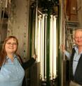 Arizona State University professors Petra Fromme and John C. H. Spence, authors on two scientific papers published in <I>Nature </I>Feb. 3, stand in front of the 122-liter photobioreactor that is used to grow cells of the thermophilic cyanobacterium <I>Thermosynechococcus elongatus,</I> which are used as the model system to study oxygenic photosynthesis.