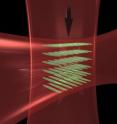 Intersecting laser beams create "optical tubes" to pack atoms close together, enhancing their interaction and the performance of JILA's strontium atomic clock.